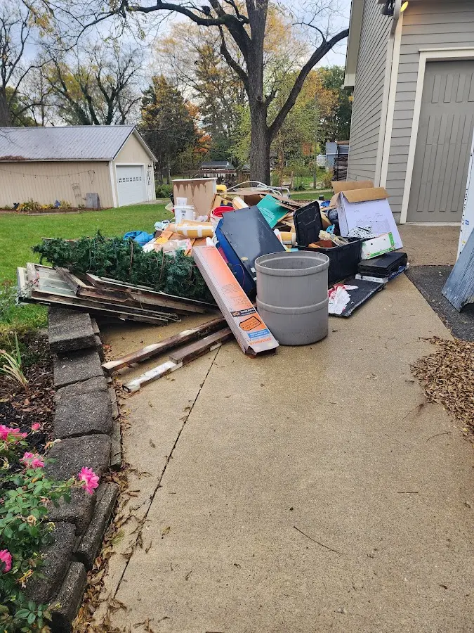 Dumpster being loaded with debris for 30 Yard Dumpster Rental in Timnath